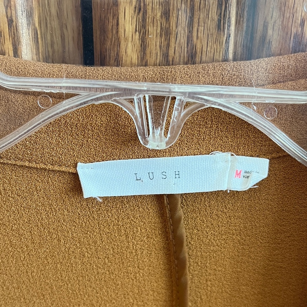 Lush Camel Gold Duster with tab sleeves and front pockets.
